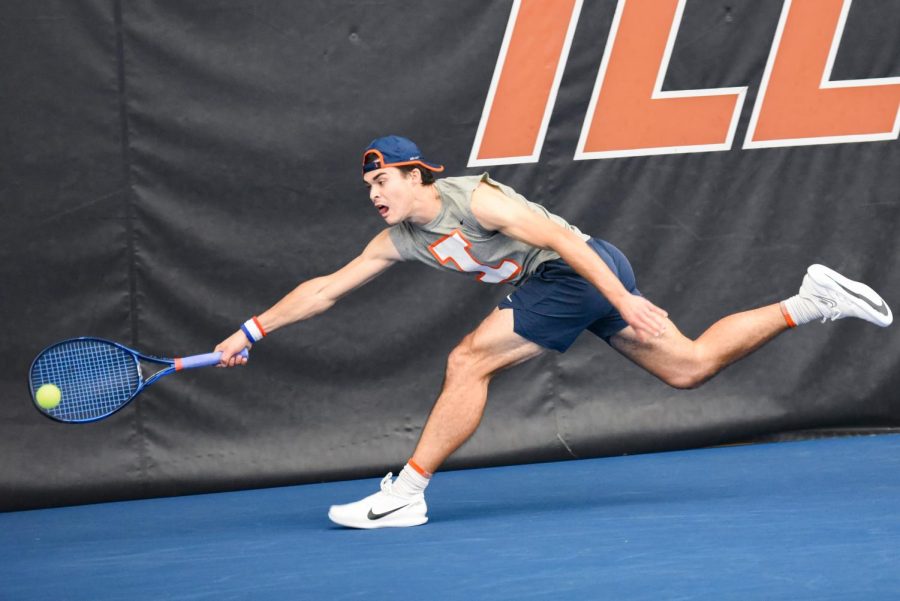 Graduate student Oliver Stuart reaches towards the ball during his singles match against Baylor on March 4. Stuart won his match against UCF on Friday with 6-4, 4-6 and 6-1, and the Illini winning overall against the Knights 4-3. 
