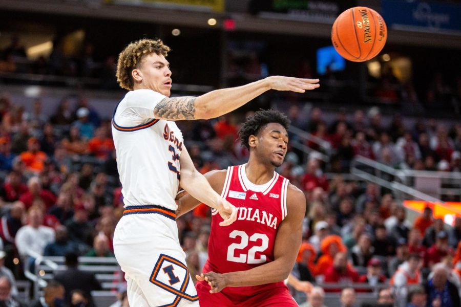 Forward Coleman Hawkins passes the ball during the Big Ten Tournament against Indiana on Friday. Hawkins was the second leading scorer for the game with 18 points. 