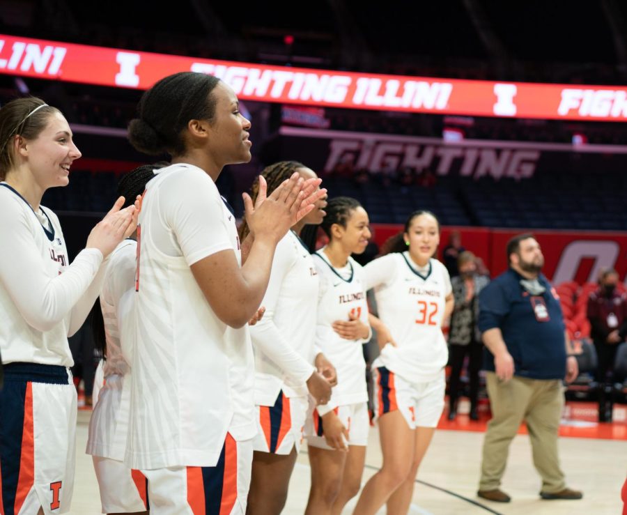 The Illini basketball team applaud after the playing of Hail to the Orange at the end of a match against Rutgers on Sunday. The Illini went on to break an 11-game losing streak  during the Big Ten Tournament on Wednesday against the Badgers.