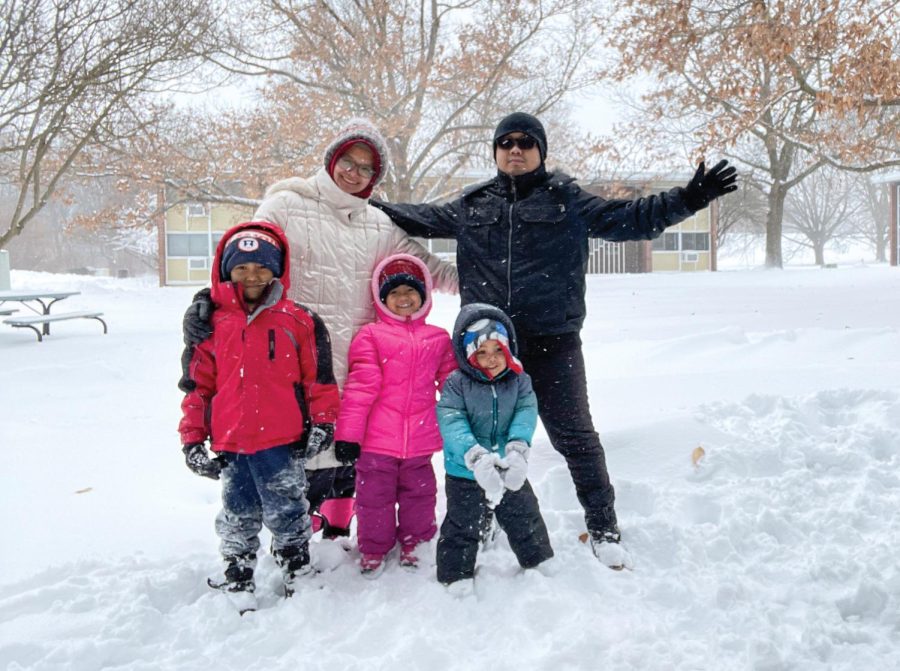 Dian Nurfajriah, a graduate student studying labor and employment relations, with her husband and her children, Gentza, Ziya and Izan, at Orchard Downs during the winter. Nurfajriah and Ilze Vaivode, a graduate student in Education, talk about their experience juggling school and motherhood. 
