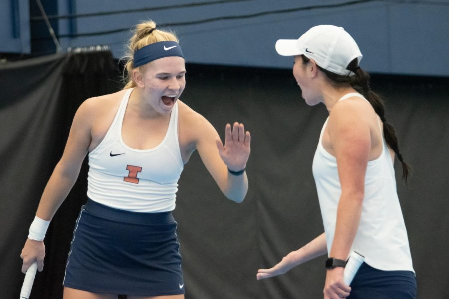 Freshman Megan Heuser celebrates with her doubles partner sophomore Kate Duong during their match against Missouri on Feb. 13. The Illini will be home for their next two games against Minnesota on Friday and Wisconsin on Sunday. 