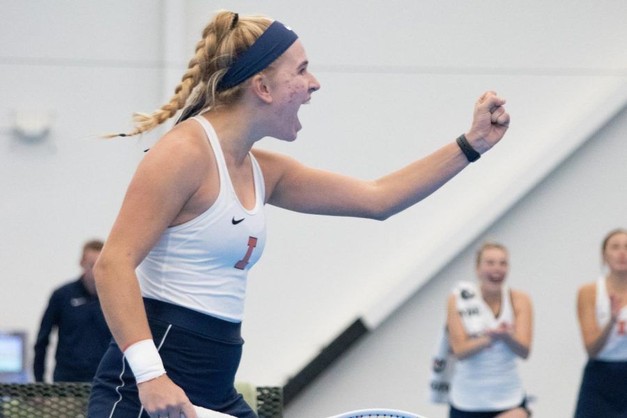 Freshman Megan Heuser celebrates a victory during her doubles competition with partner Sophomore Kate Duong against Illinois State on Feb. 6. Heuser and Duong won their match against Maryland 6-1 on Friday. 