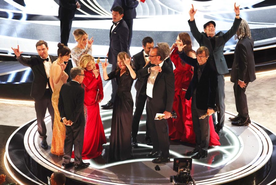 The cast and producers of CODA accept their  award during the the 94th Academy Awards on Sunday. CODA is the first film from a streaming service to win Best Picture.  