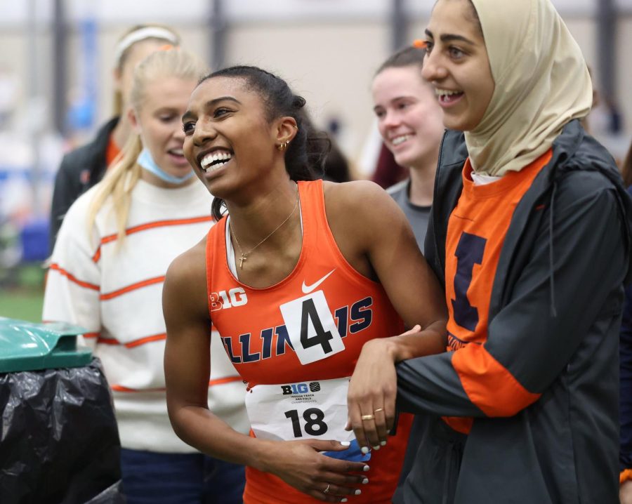 Runner Olivia Howell celebrates with her team after completing an event during the Big Ten Indoor Championship on Feb. 27. Howell is one of three  to represent the Illini at NCAA Indoor Championships on Friday and Saturday. 