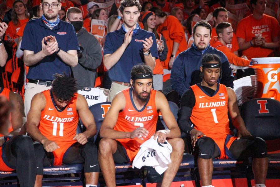 Graduate student guard Alfonso Plummer, graduate student forward Jacob Grandison and senior Trent Frazier set on the bench during pregame introductions during Illinois 86-83 loss to Ohio State on Feb. 24 at State Farm Center. The trio, along with senior guard DaMonte Williams and junior center Kofi Cockburn, will be honored during Senior Night festivities prior to the game against Iowa on Sunday.