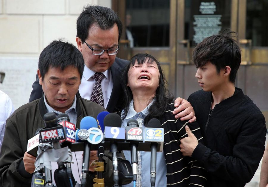 Mother of Yingying Zhang, Lifeng Ye, wails in grief as her son Zhengyang Zhang and Dr. Kim Tee consoles her during Ronggao Zhang’s statement to the media outside the U.S. Courthouse in Peoria on June 24, 2019. After five years since Zhang’s murder it still continues to bring awareness to the need for better campus safety and views of Asian Americans today.