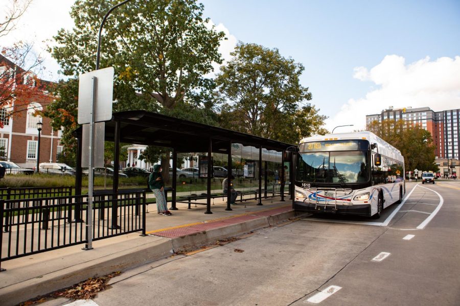 A 2U Red MTD bus stops at the Illini Union bus stop in Oct. 25. MTD has announced that they have lifted the mask mandate for passengers.