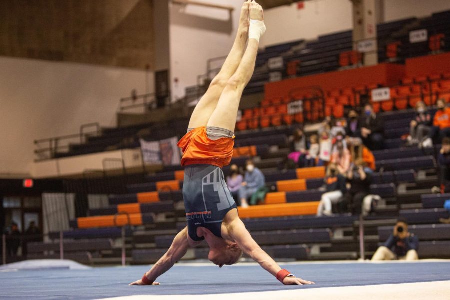 Senior Hamish Carter performs his floor routine during the competition against Oklahoma on Feb. 12. The Illini will be heading towards the playoff for the Big Ten Championship at University Park, Pennsylvania on Friday and Saturday.