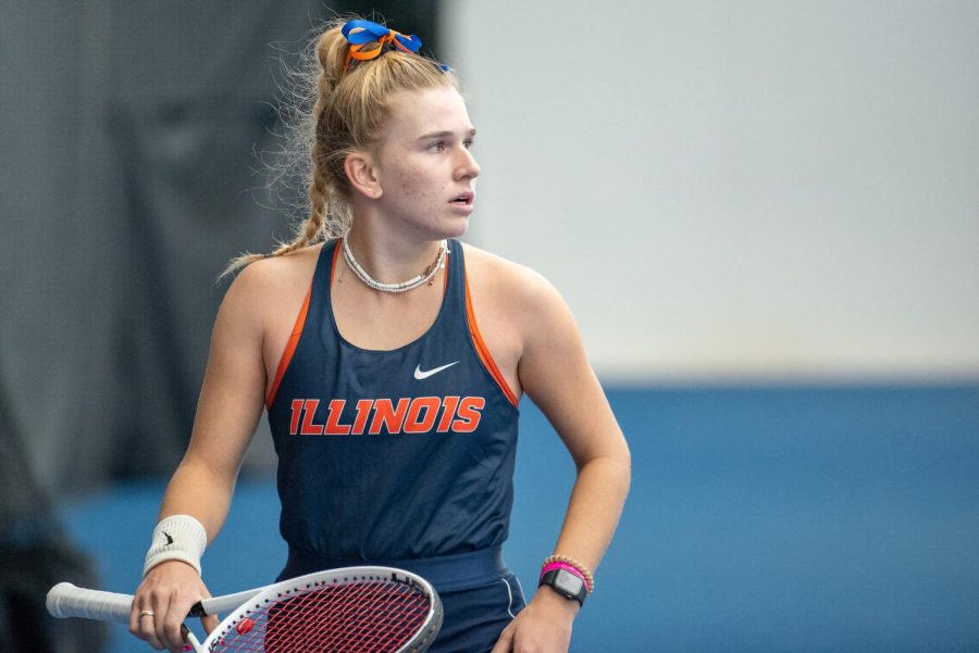 Freshman Megan Heuser walks on to the court before her doubles match with partner sophomore Kate Duong against Rutgers on March 27. The Illini finish their regular season with a loss against Michigan on Friday, 4-1, and victory against Michigan State on Sunday, 4-1. 