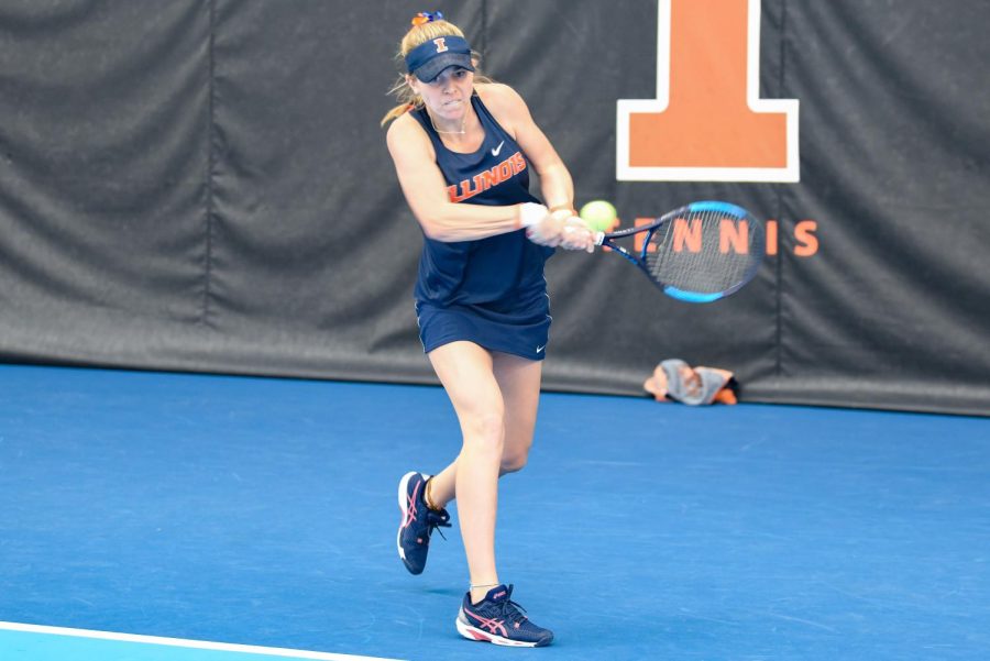 Junior Josie Frazier strikes the ball during her singles match against Rutgers on March 27. The Illini will be having their last home match up of the season against in-state rivals Northwestern on Sunday. 