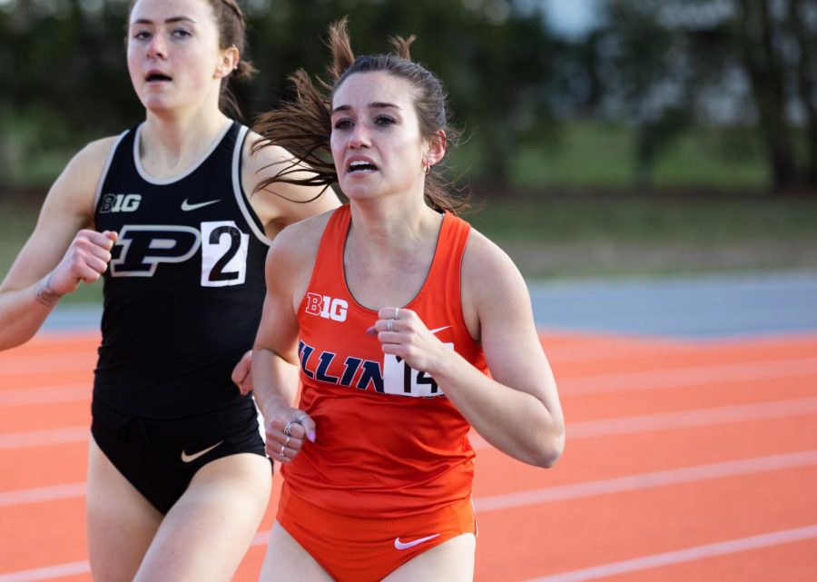Distance runner Rebecca Craddock runs laps while attempting to take the lead during the Illini Classic on Saturday. Craddocks confidence carried from her record breaking performance at Stanford to Saturdays event.