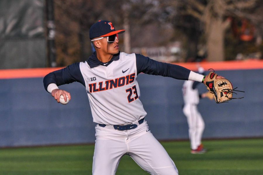 Junior+infielder+Branden+Comia+prepares+to+throw+the+ball+during+a+warmup+before+an+inning+for+the+game+against+Eastern+Illinois+on+March+8.+The+Illini+achieved+a+victory+against+Bradley+on+Wednesday+9-6.++