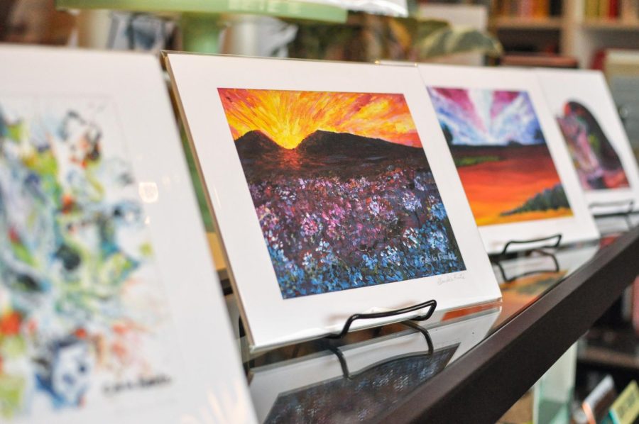 Artist Clara de la Fuente’s paintings are displayed during the local artist market hosted by The Literary on Saturday. The market gave local artists a space to showcase their work from paintings, prints and earrings. 