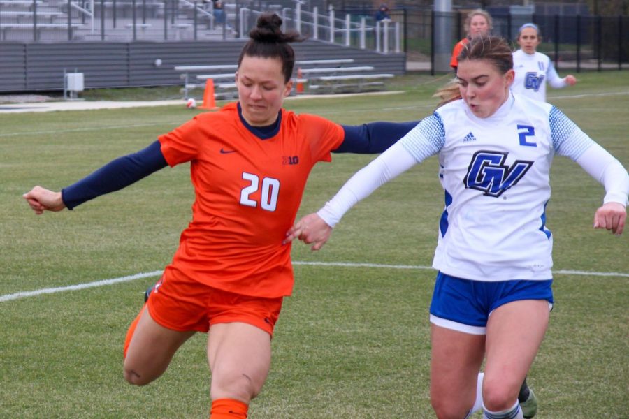 Senior forward Makena Silber readies to kick the ball with a Grand Valley at her side attempting to block the kick on April 2. The Illini will be having a double match up on Saturday against Illinois State and Indiana.   