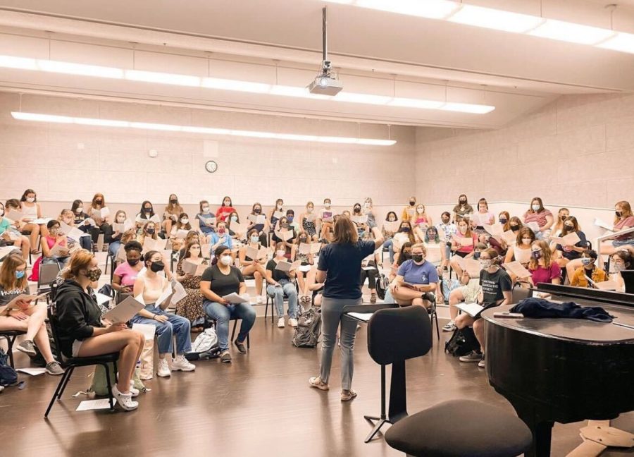 The Womens Glee Club sing together for the first time since the pandemic started in Krannert Center for the Performing Arts on Aug. 13. The group is the largest choir in the University, but receive a lack of funding. 