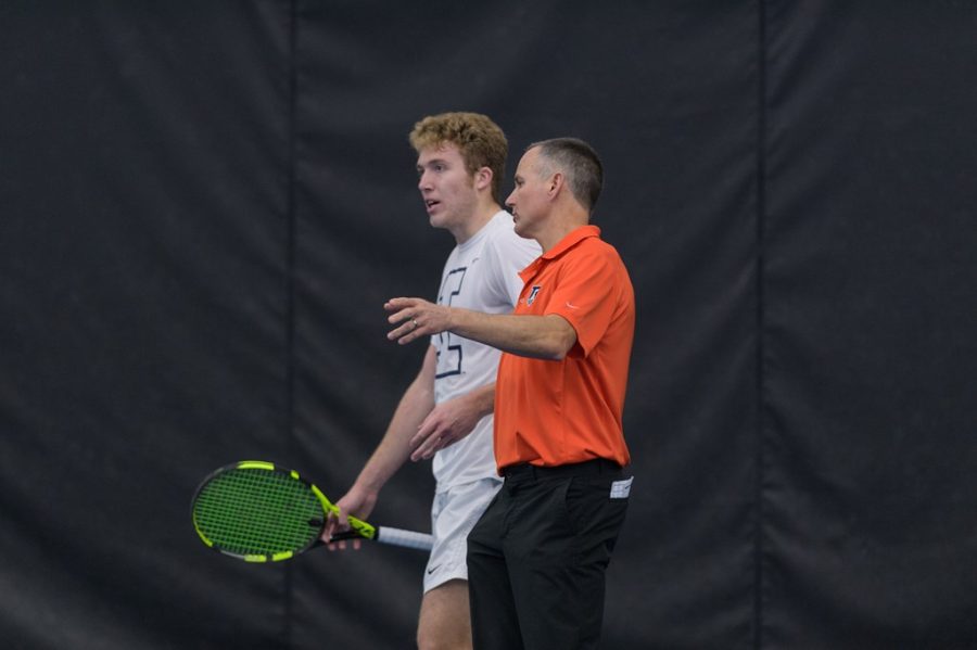 Illinois mens tennis head coach Brad Dancer talks with graduate student Alex Brown during his singles match against TCU on March 5. The Illini will be competing at Atkins for 3 match ups this weekend against Michigan, Michigan State and Butler. 