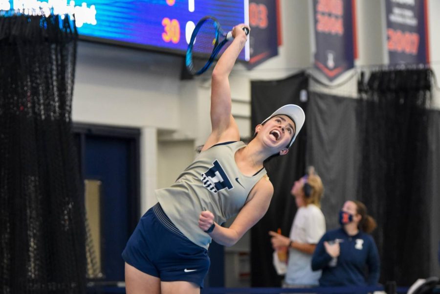 Sophomore+Kate+Duong+leaps+in+the+air+to+return+the+ball+during+her+doubles+match+with+teammate%2C+freshman+Megan+Hesuer%2C+against+Missouri+on+Feb.+13.+Big+Ten+announced+that+Duong+is+to+be+part+of+the+All-Big+Ten+team+on+Thursday.+