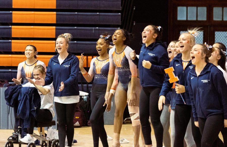The+Illinois+womens+gymnastics+team+cheers+from+the+sides+during+the+floor+exercise+routines+on+March+4.+The+Illini+scored+5-3+for+the+the+season+overall.+
