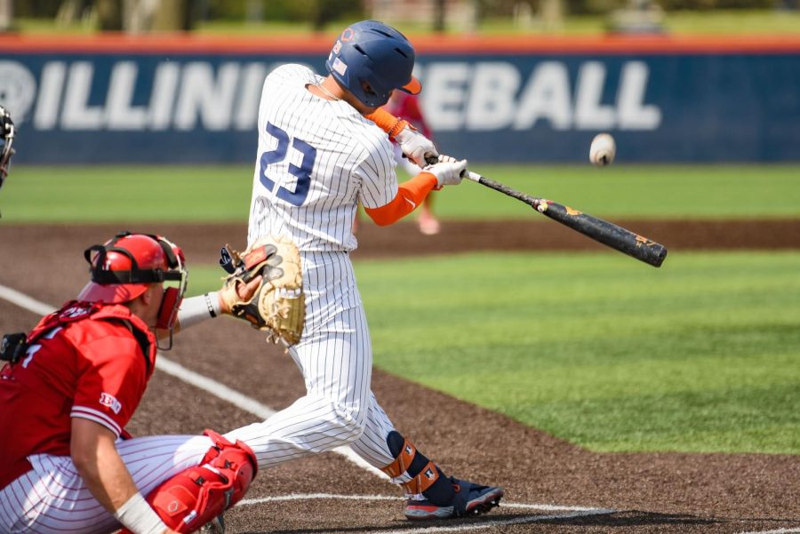 Junior Branden Comia smacks the ball with his bat during the game against Nebraska on Saturday. The Illini won their final home series against Nebraska with two wins out of the three games: 8-3 on Friday and 5-4 on Sunday. 