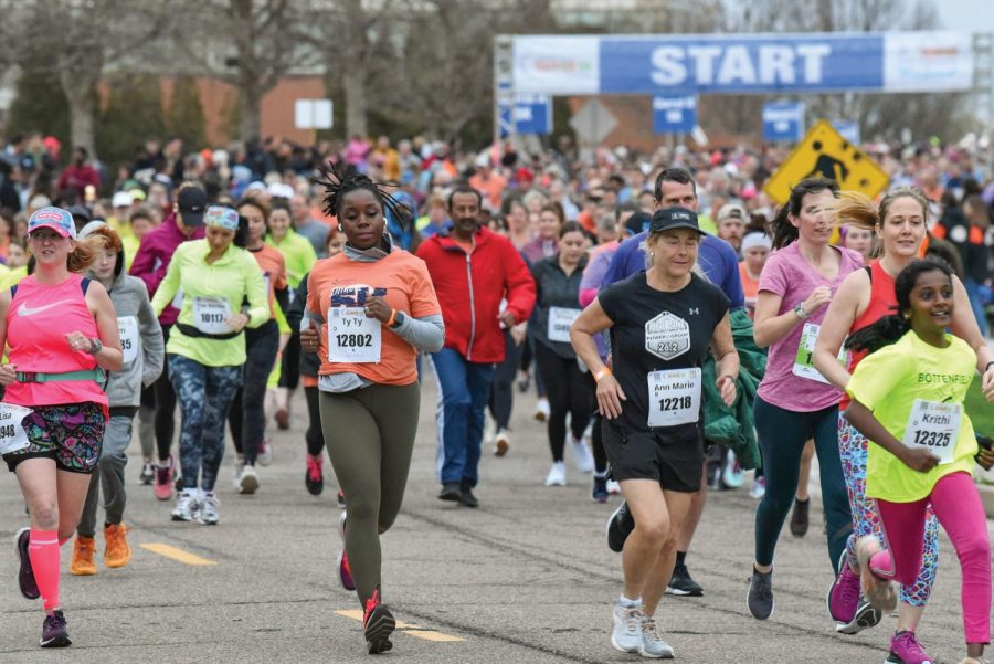 Runners take off at the start of the Illinois 5k Marathon on Friday. 
