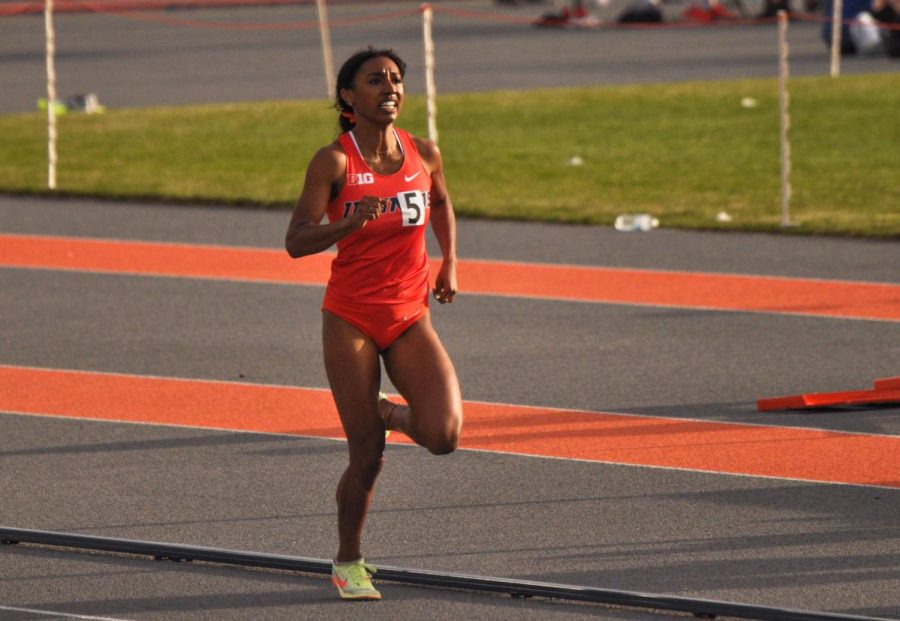 Junior runner Olivia Howell speeds towards the finish line as she takes the lead for her event at the Illini Invite on April 23. Howell won her fourth consecutive Big Ten championship with a 4:21 time in the 1500m on Saturday. 