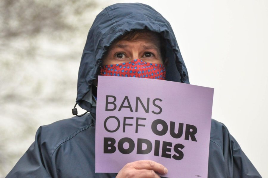 Stephanie Slife holds a sign saying Bans off our bodies at a protest in  front of the Champaign County Courthouse on Tuesday. The protest was held in support of reproductive rights and abortion access following the leaked draft from the Supreme Court.