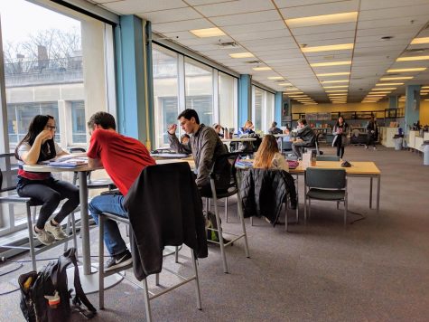 Students study at the Undergraduate Library on March 12, 2019. The UGL will be closing on Saturday in starting its four-year renovation with other locations such as the ACES and the Grainger Engineering library providing accommodations for students. 
