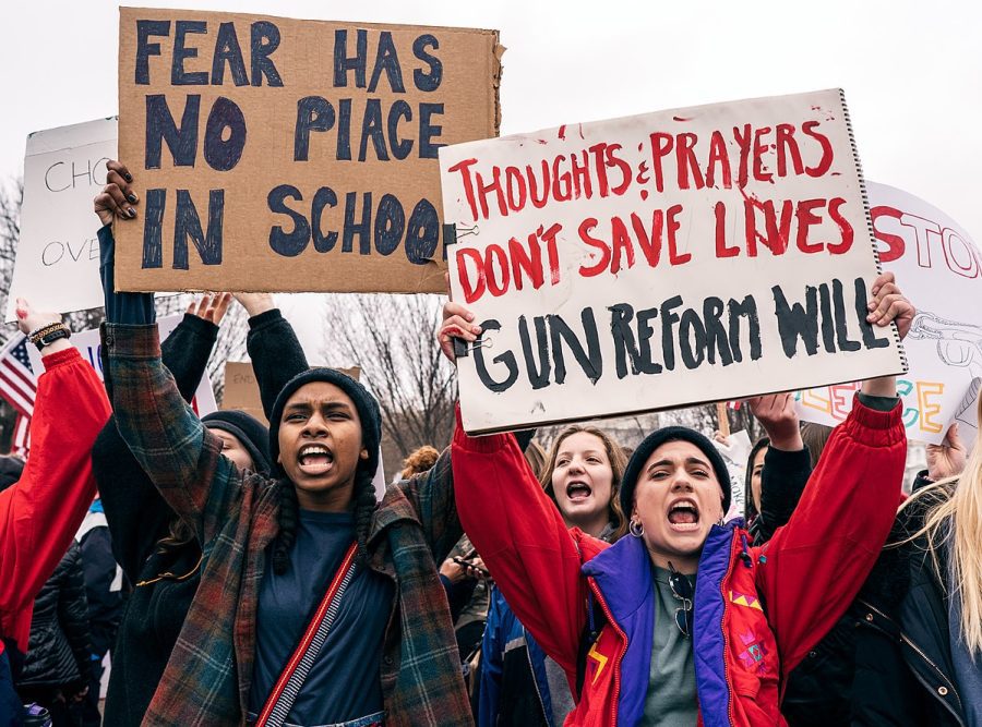 Teens hold signs and protest for gun reform in Washington, DC on February 19, 2018 after a Highschool shooting in Parkland, Florida. Senior Columnist Andrew Prozorovsky believes that the Uvalde tragedy is not just another mass shooting and that new gun regulations need to be made now to prevent against Americas gun problem. 