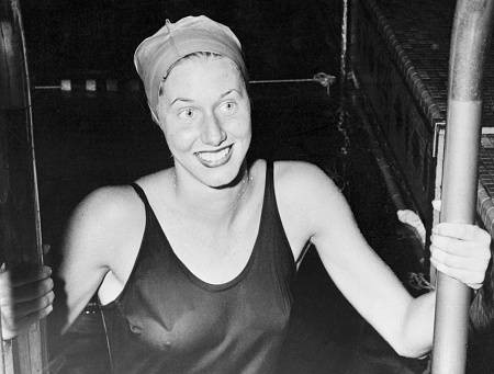 Jody Alderson Braskamp emerges from the Chicago Town Club swimming pool after setting a new world and American swimming mark for the 100 yard freestyle with a time of 58.1. Braskamp is among a handful of Illinois athletes who have been inducted into the Hall of Fame on Monday. 