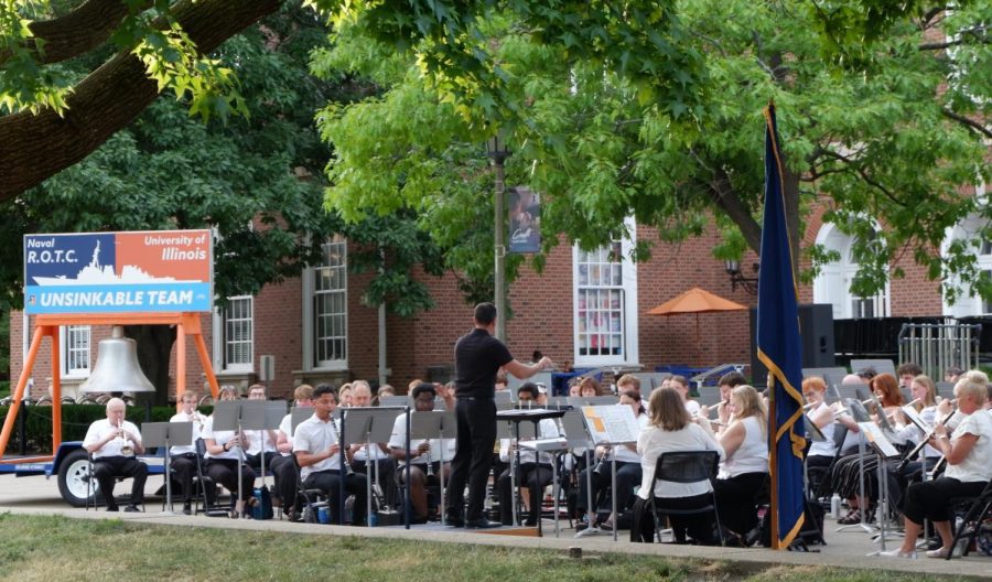 Summer band led by Marching Illini director Barry Houser perform on the Main Quad on Thursday evening. The summer band made of a diverse set of musicians continue the 110 year summer tradition with an array of scores that end the concert with another prosperous performance for the summer tradition.