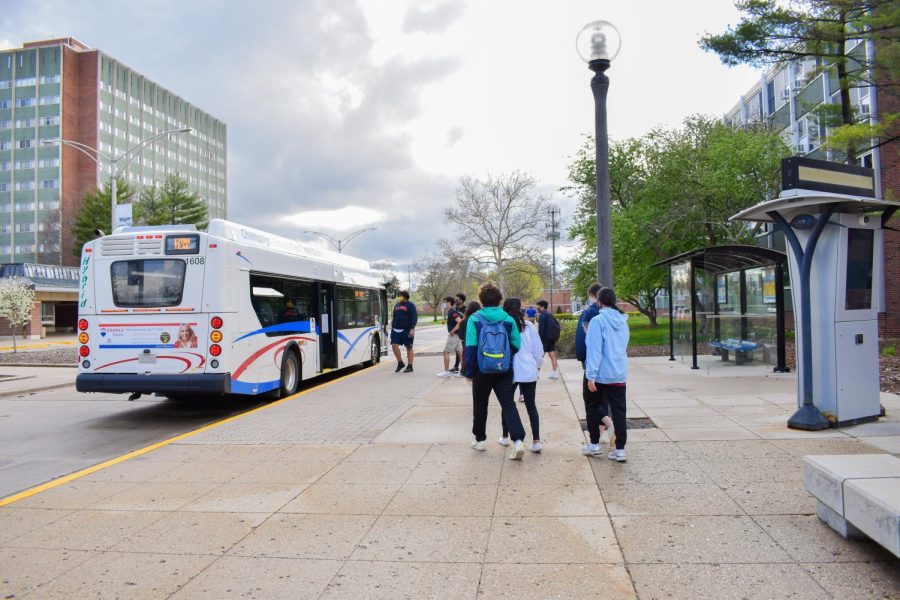 Students board the 120W Teal bus at the stop in front of the PAR residence hall on April 10, 2021. MTD has announced a change to some of the bus routes, such as the 22/220 Illini, 12 Teal and 13/130 Silver, due to a staff shortage. 