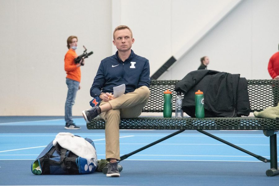 Illinois womens tennis head coach Evan Clark watches sophomore Kate Duong and freshman Megan Heusers doubles match against Illinois State on Feb. 6. The team has recruited recruit Violeta Martinez in preparations for the upcoming season. 