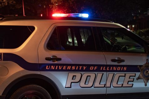 A University police car patrols the streets on Sept. 29, 2020. An off-duty UI police officer has been charged with official misconduct on Monday in trying to obtain a personal advantage in pretending to be an undercover cop. 