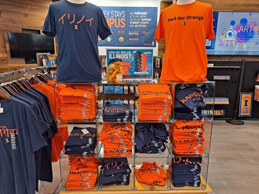 A display of Hail to the Orange and Illinois t-shirts translated in different languages at the Illinois Union Bookstore. Some of the t-shirts were mistranslated and quickly gained student attention. 