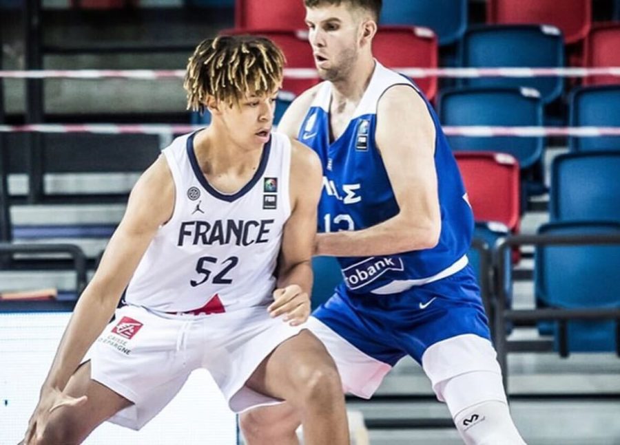 Forward Zacharie Perrin dribbles the ball during a game for International Basketball Federation. Perrin has committed to the Illinois mens basketball team on Monday. 