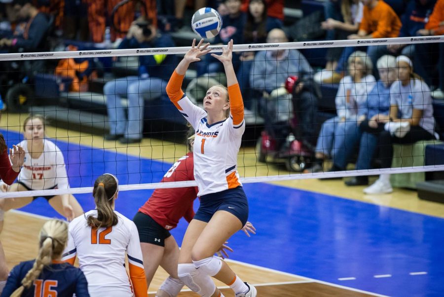 Setter Jordyn Poulter jumps to set the ball in order for the Illini to make a score against Louisville on December 1, 2018. Poulter, former setter for Illinois volleyball  and 2020 gold medalist for the Tokyo Olympics recently had her medal stolen from her vehicle along with other personal possessions last Wednesday. 