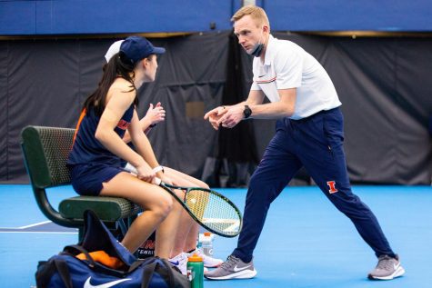 Womens Tennis head coach Evan Clark heads over to have a quick chat with athletes on Feb. 6, 2021. Clark opens up about the team not being found on the upcoming NCAA tournament and taking advantage of the upcoming season to continue to improve. 