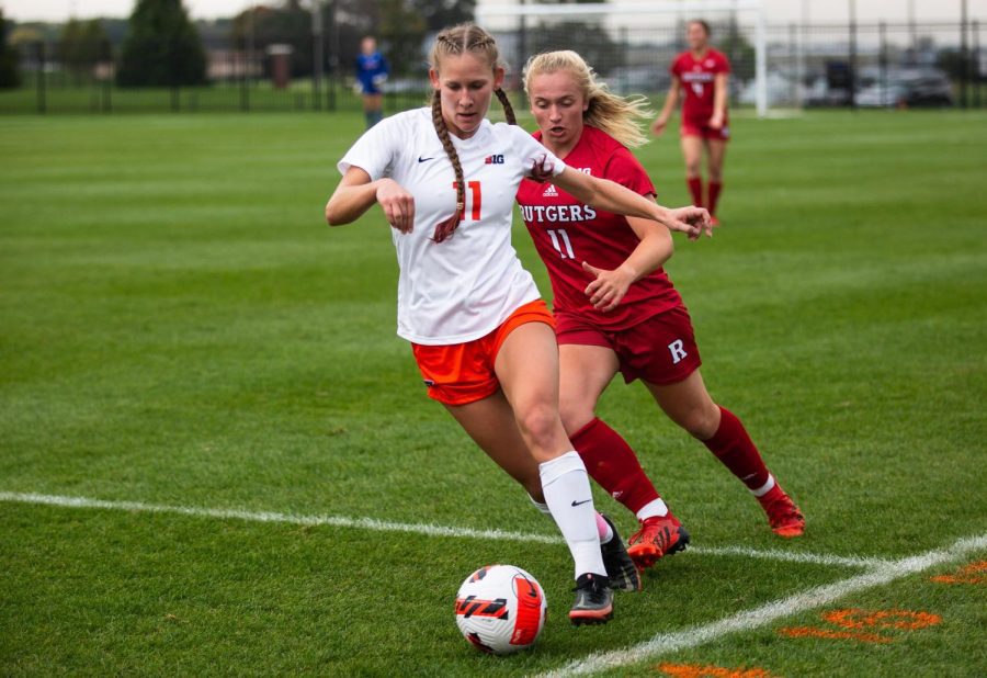 Defensive Aleah Treiterer attempts to keep the ball away from Rutgers on Oct. 23. Despite the disappointing performance last season for the Illini, this season shines hope for a better turn out with the teams new faces and  performance during the recent August exhibition matches. 