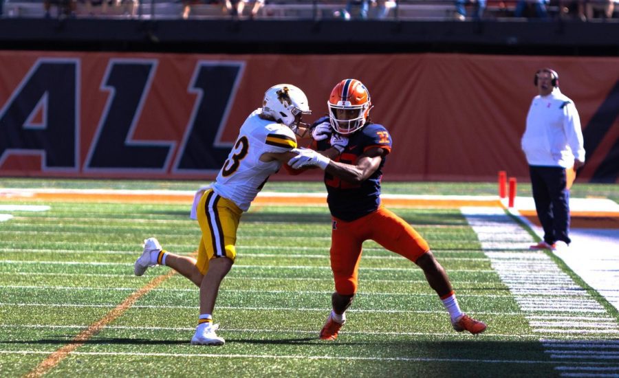 Senior defensive back Tailon Leitzsey attempts to run past a Wyoming opponent during the game on Saturday. 