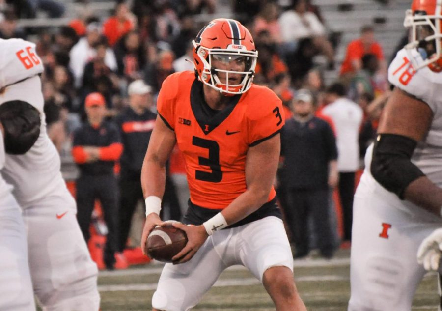 Senior+quarterback+Tommy+DeVito+looks+for+an+opening+during+the+Spring+Orange+and+Blue+game+on+April+21.+DeVito+is+a+fifth-year+senior+quarterback+who+transferred+from+Syracuse+in+the+spring.