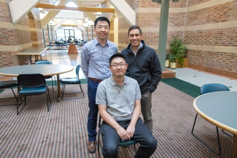 Professors Pengfei Song and Daniel Llano pose with graduate student Qi You who aided in Song and Llano’s research. Song and Llano collaborated in developing ultrasound imaging tools that can help study Alzheimer’s disease. 