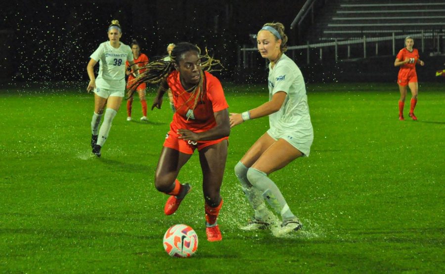 Junior forward Makala Woods dribbles the ball past an Indiana State opponent on Sunday. The Illini won 3-2. 