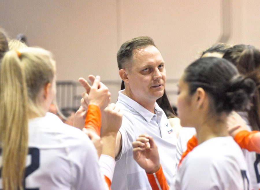 Illinois volleyball head coach Chris Tamas huddles and speaks with the team during an intermission for the game against Maryland on Sept. 23. The Illini will be up against the Boilermakers at Huff Hall on Friday. 