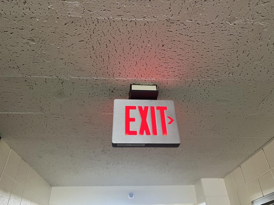 A+new+exit+sign+is+added+in+Scott+Hall+following+the+vandalism+which+occurred+on+September 15+The+student+allegedly+ripped+23 +exit+panels%2C+ damaged+ceiling+tiles+and+revealed+interior+wiring+.%C2%A0%0A