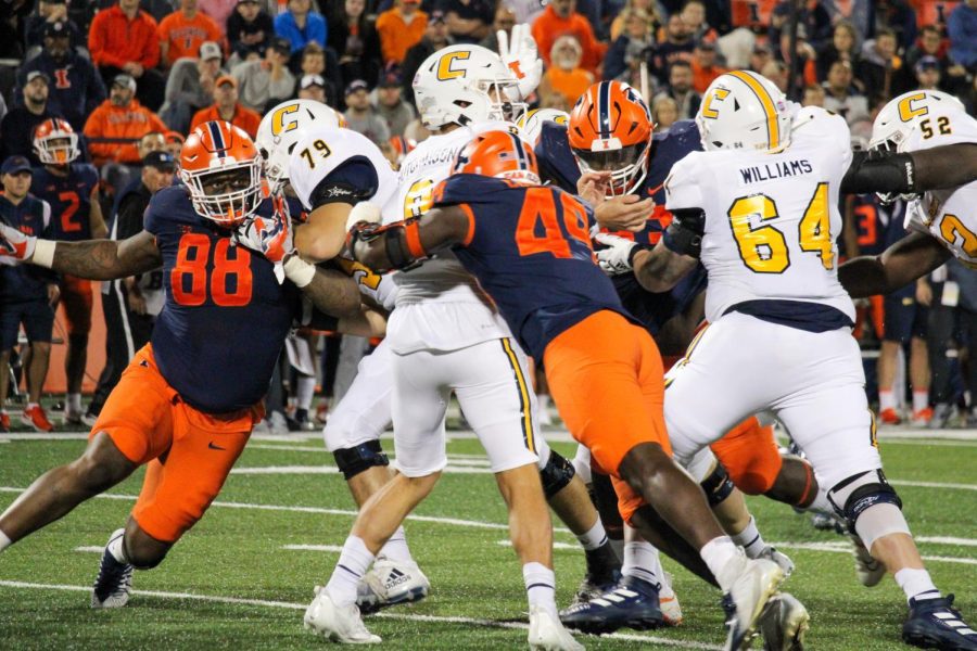 Sophomore linebacker Seth Coleman hits the Chattanooga quarterback in the pocket. The Illinois defense dominated their opponent throughout the night.