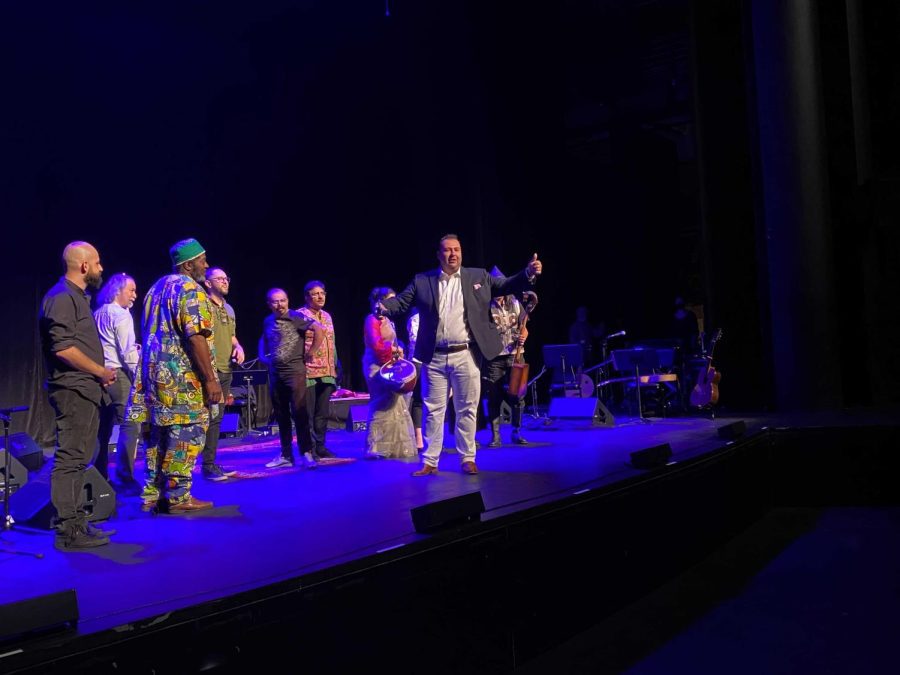 Vocalist Sam Taheri thanks the audience at the end of the Chicago Immigrant Orchestra’s performance at the Krannert Center for the Performing Arts on Tuesday. 