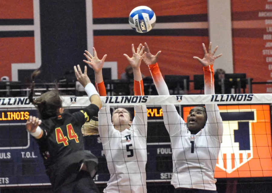 Redshirt senior Diana Brown (5) and senior middle blocker Kennedy Collins (1) attempt to block the ball against Maryland on Sept. 23. 