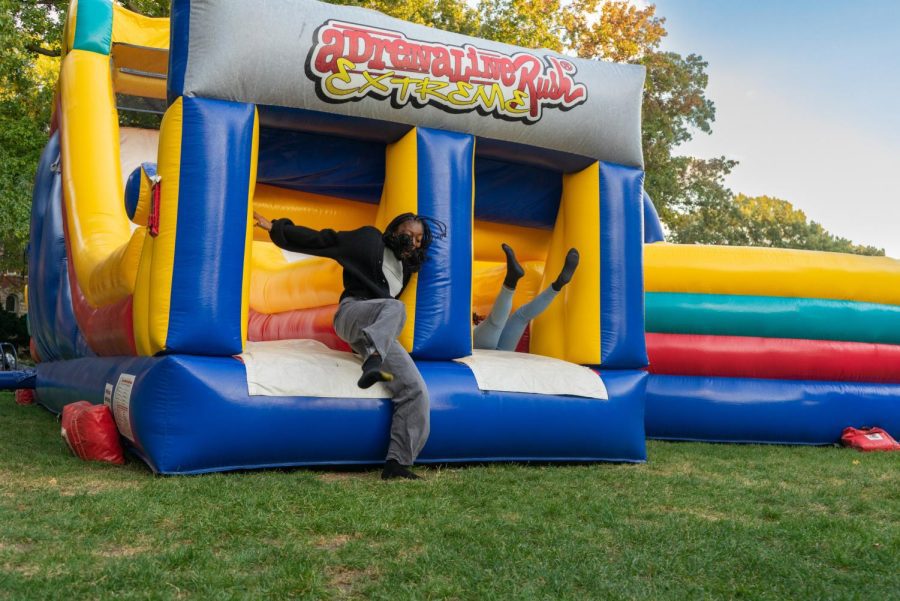 Students fly out of the bouncy house during the Party on Main Quad event hosted by the Illini Union Board and the Student Alumni Ambassadors on Monday. 