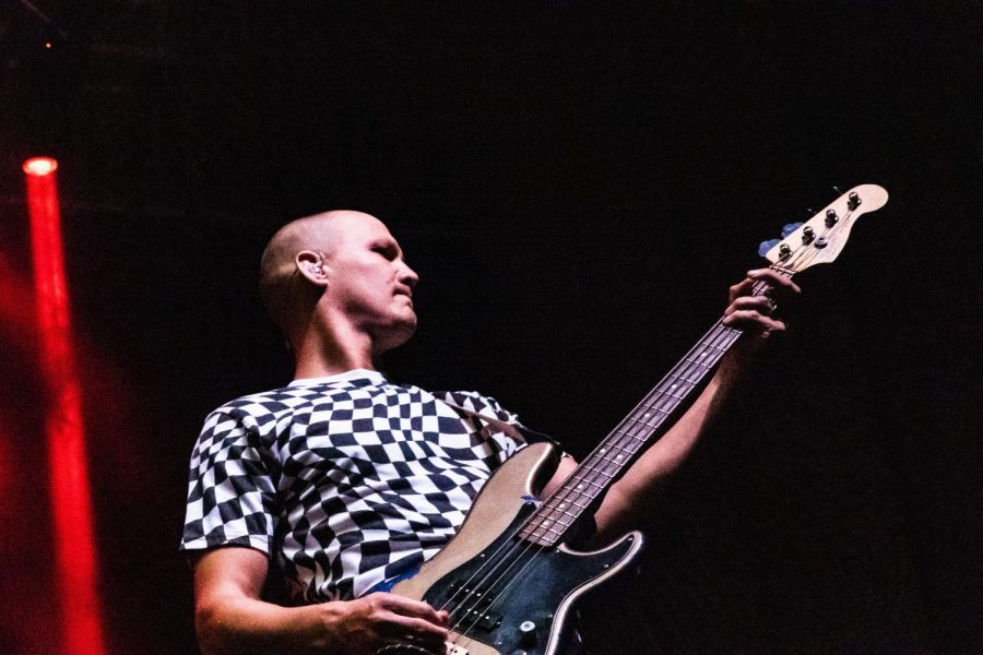  Bassist player for Neon Trees performs for the C-U community at the State Farm Center on Wednesday.