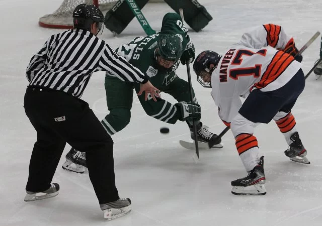 Junior forward Alexander Matveev tries to take the puck during a face off against Ohio State on Friday. 
